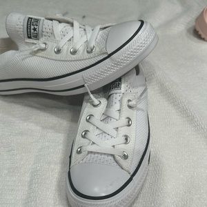 Converse Chuck Taylor’s All Star tennis shoes.